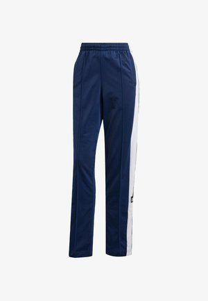 Navy blue track pants with an elastic waistband, side pockets, and white stripes along the outer seams. Made from a smooth polyester material.