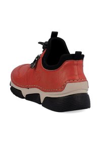 Red leather shoe with a textured finish, a black rubber sole, and a zip closure detail. Features contrasting white stitching and rear pull tab.