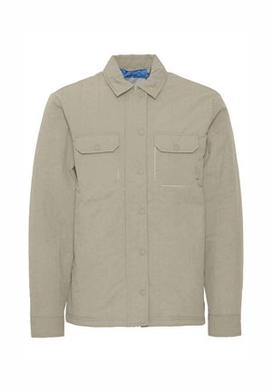 Beige Hemdjacke aus strukturiertem Stoff, mit spitzem Kragen, zwei Vordertaschen und Druckknöpfen; Innenfutter in Blau.