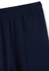 Leggings de cintura elástica en azul marino, confeccionados en tejido de punto suave, con una textura lisa y una cintura fruncida para mayor comodidad.