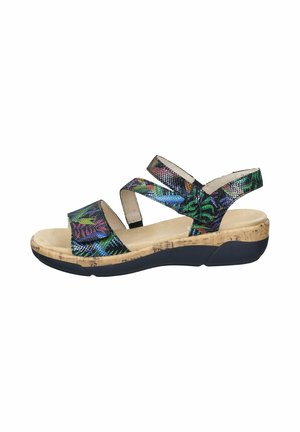 Kork wedge sandaler med flerfarvede strukturerede remme, der viser en blanding af grønne, blå og lilla mønstre på en tan indersål og sort sål.