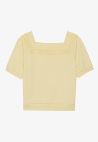 Short-sleeve, square-neck top in light yellow cotton, featuring a textured knit detail along the neckline and a relaxed fit.