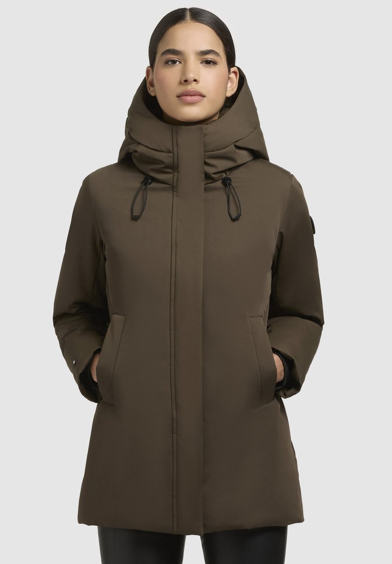 Brown, insulated parka with a high collar and hood. Features two front pockets and adjustable drawstrings. Smooth, matte fabric texture.