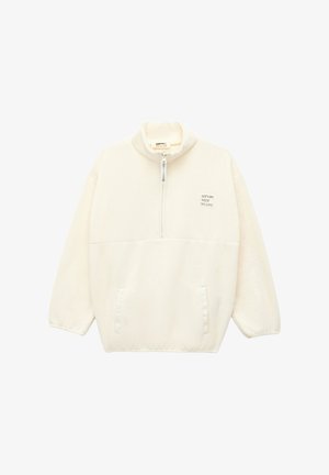 Pulower z polaru w kolorze kremowym z wysokim kołnierzem, pół-zapinanym przodem i dwiema przednimi kieszeniami. Posiada mały nadruk z tekstem na klatce piersiowej.