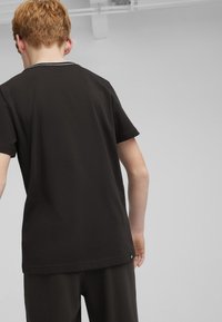 Puma SQUAD - Camiseta estampada - black