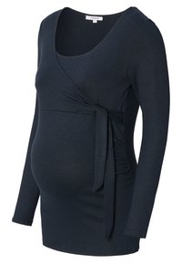 Stillshirt aus navy Stretchmaterial mit Wickeldesign, langen Ärmeln, seitlichen Raffung und einem Bindegürtel in der Taille.