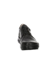 Chaussure en cuir noir avec une texture lisse, bout rond et design sobre. Présente un laçage minimal et une semelle en caoutchouc texturée.