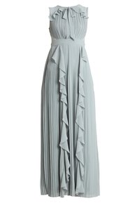 Valkoinen sävyinen, poimutettu maksimekko, jossa on röyhelökoristeita, hihaton malli ja nauhakiinnitys kaulassa. Materiaali näyttää kevyeltä ja valuvalta.