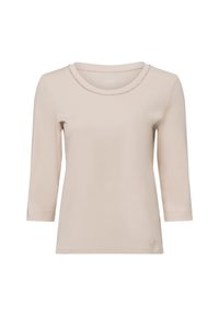Beige langsloven shirt met een ronde halslijn, voorzien van een gestructureerde rand. Gemaakt van een zachte stof, heeft het een relaxte pasvorm en zijsplitten.