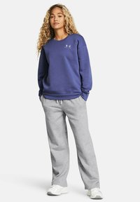 Under Armour RIVAL - Spodnji deli trenirk - mod gray light heather