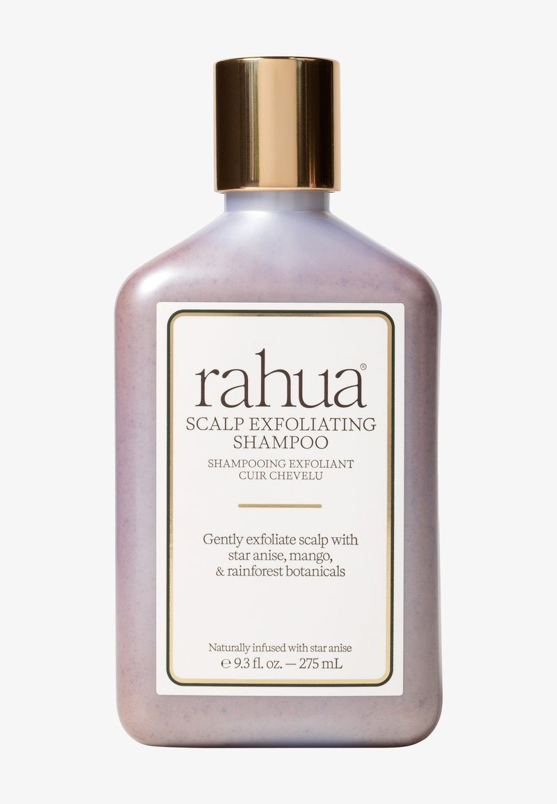 Shampooing exfoliant pour cuir chevelu Rahua dans une bouteille lavande incurvée de 275 mL avec un bouchon doré, présentant une étiquette blanche avec texte noir et détails botaniques.