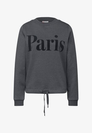 Grå sweatshirt med "Paris" trykt i sort. Har lange ærmer, rund hals og en snøre i kanten til justering af pasformen.