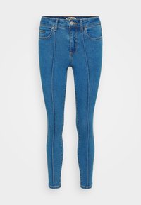 Οι μπλε τζιν skinny παντελόνες διαθέτουν ψηλή μέση, μπροστινές τσέπες και αντίθετη ραφή κατά μήκος των ραφών. Έχουν λείο συνολικά υφασμά.