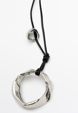 Silver-toned metal pendant with a twisted shape, strung on a black leather cord, featuring a knot detail near the clasp.