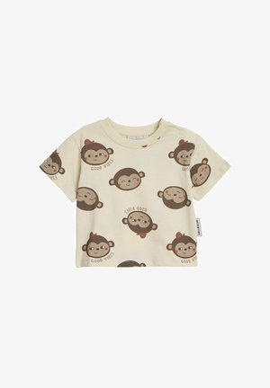 Vaalean khakivärinen T-paita lyhythihaisena pehmeästä puuvillasta, jossa on leikkisä apinamotiivi ja ruskealla kirjoitettu "HYVÄT VIBRAT".