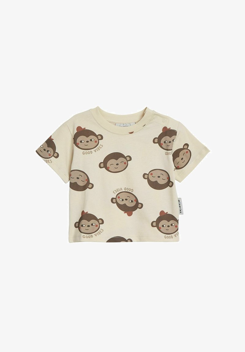 Korte ærmer cremet T-shirt i blød bomuld med et legende abe-mønster og teksten "GOOD VIBES" i brun.