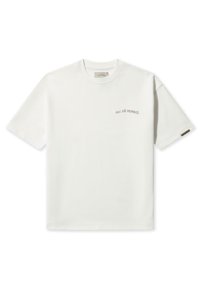 Hvid bomulds t-shirt med rund hals, korte ærmer og "PAS DE MONACO" trykt i en buet, subtil skrifttype på brystet.