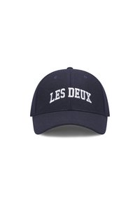 Navy blue cap made of fabric, features white embroidered text "LES DEUX" on the front, structured crown, and curved brim.