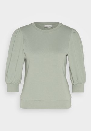 Lichtgroene pullover gemaakt van zachte stof, met pofmouwen, een ronde halslijn en geribde manchetten en onderkant. Soepele, gestructureerde afwerking.