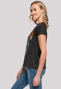 Black cotton t-shirt with short sleeves, featuring a colorful graphic design on the front. Slim fit with a crew neckline.