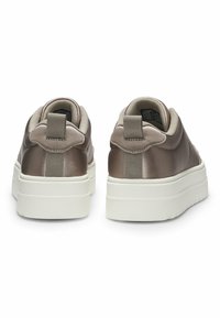 Brown satin sneakers with a thick white sole, rounded shape, and fabric loop at the heel for easy pulling. Smooth texture and minimal design.