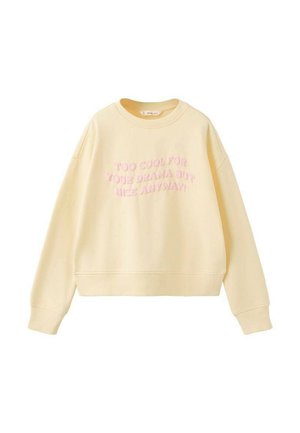 Sweat-shirt jaune clair à col rond avec manches longues et texte rose indiquant "TROP COOL POUR VOS DRAMES MAIS QUAND MÊME SYMPA !" sur le devant.
