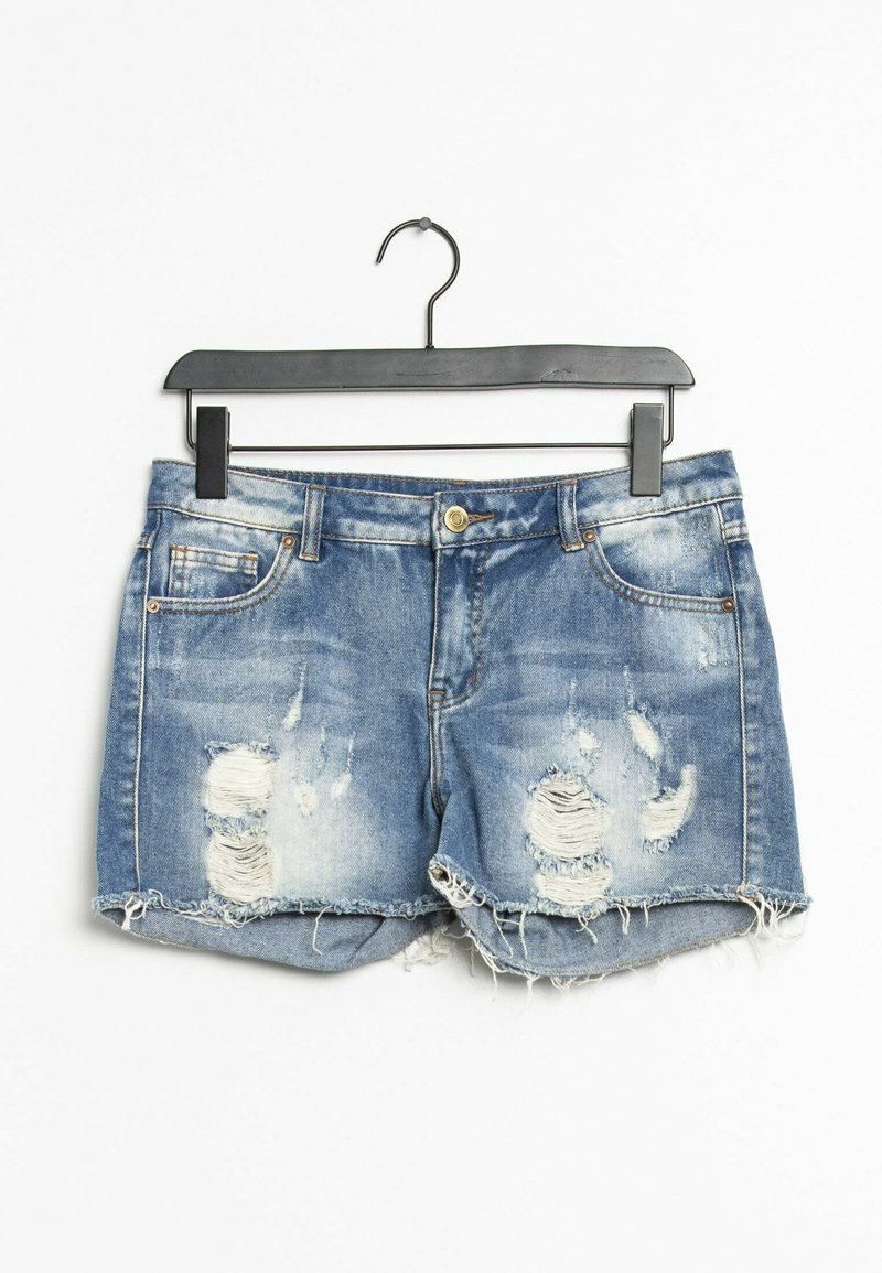 Farkkuhousuissa on haalistunut sininen pesu, frayed-helmat ja kulutetut tahrat edessä. Niissä on viisi taskua ja edessä nappilukko.