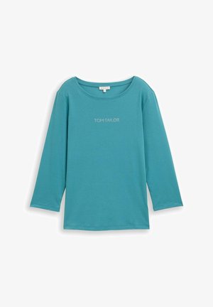 Türkiz kerek nyakú, hosszú ujjú póló, puha anyagból készült. Az elején ezüstszínű "TOM TAILOR" logó található.
