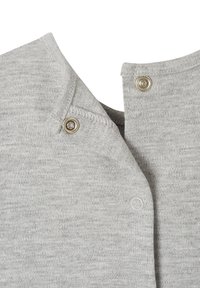 Gray knit fabric with a collared neckline, featuring metal snap fasteners. Smooth texture and subtle heathered pattern throughout.