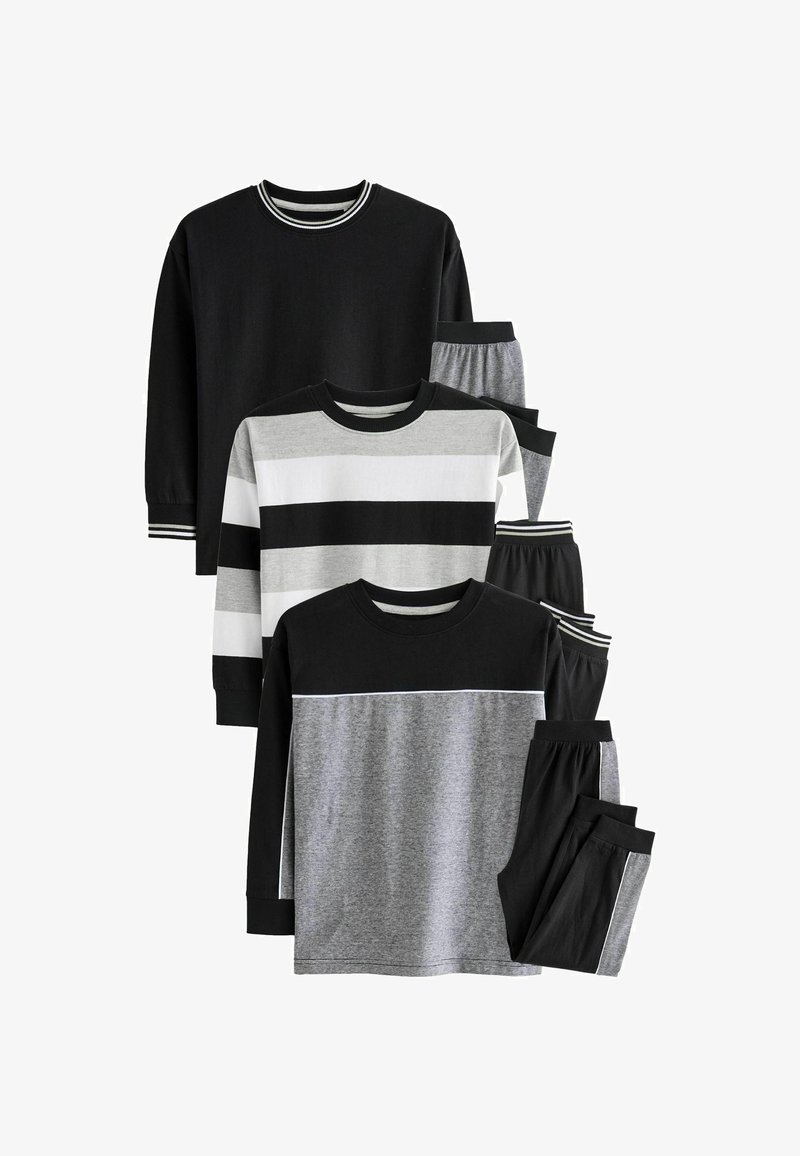 Dwa komplety odzieży domowej dla dzieci w czarnych, szarych i białych tkaninach. Zawierają koszulki z długim rękawem o różnych wzorach w paski oraz spodnie.