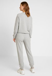 Nike Sportswear Treniņtērpa apakšdaļas - grey heather/white