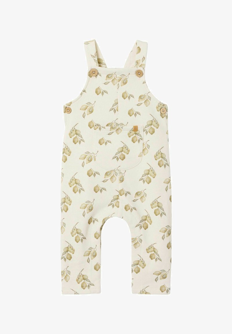 Krémové lacláče se vzorem listů v zelené a žluté barvě. Obsahují nastavitelné stahovací ramínka, dřevěné knoflíky a přední kapsu.