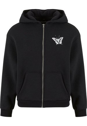 Black zip-up hoodie made of cotton blend. Features a front pocket and white butterfly graphic on the left chest. Ribbed cuffs and hem.