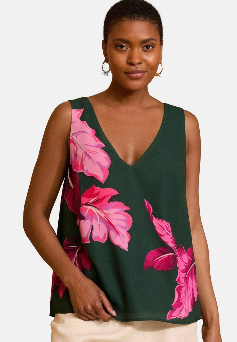 Zöld virágmintás ujjatlan topp, nagy rózsaszín levélmintákkal, mély V-kivágással. Simogató anyag, laza fazonban.