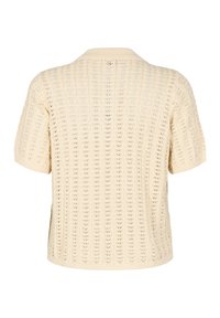 Brede gebreide short-sleeve trui in crème, met een open breipatroon en een geribde kraag. Losvallend model met een rechte zoom.