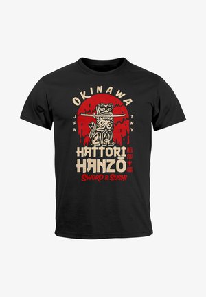 Black cotton t-shirt featuring a graphic print of a stylized creature holding a sword, with red and beige text detailing "Okinawa" and "Hattori Hanzo."