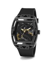 Black rubber strap watch with a rectangular case. Dial features a black dragon design, gold accents, and yellow hands. Brand name "GUESS" displayed.