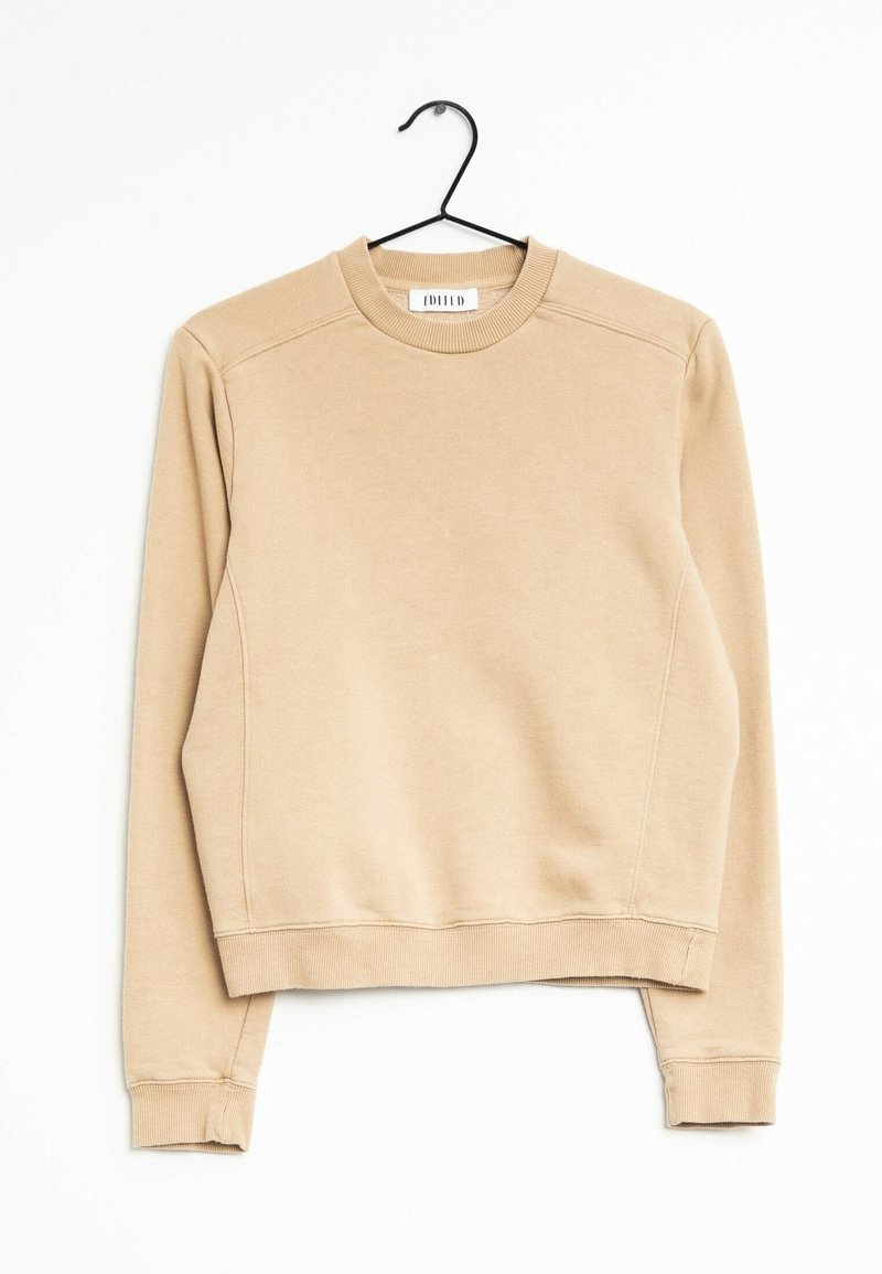 Pull beige avec un col rond, des manches longues et des poignets côtelés. Fabriqué en matériau doux, avec une conception d'épaule sans coutures et une coupe décontractée.