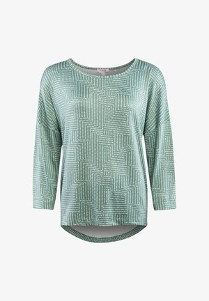Langärmliges, mintgrünes Oberteil mit weiß gepunktetem, geometrischem Labyrinthmuster und rundem Ausschnitt, hinten etwas längerer Saum.
