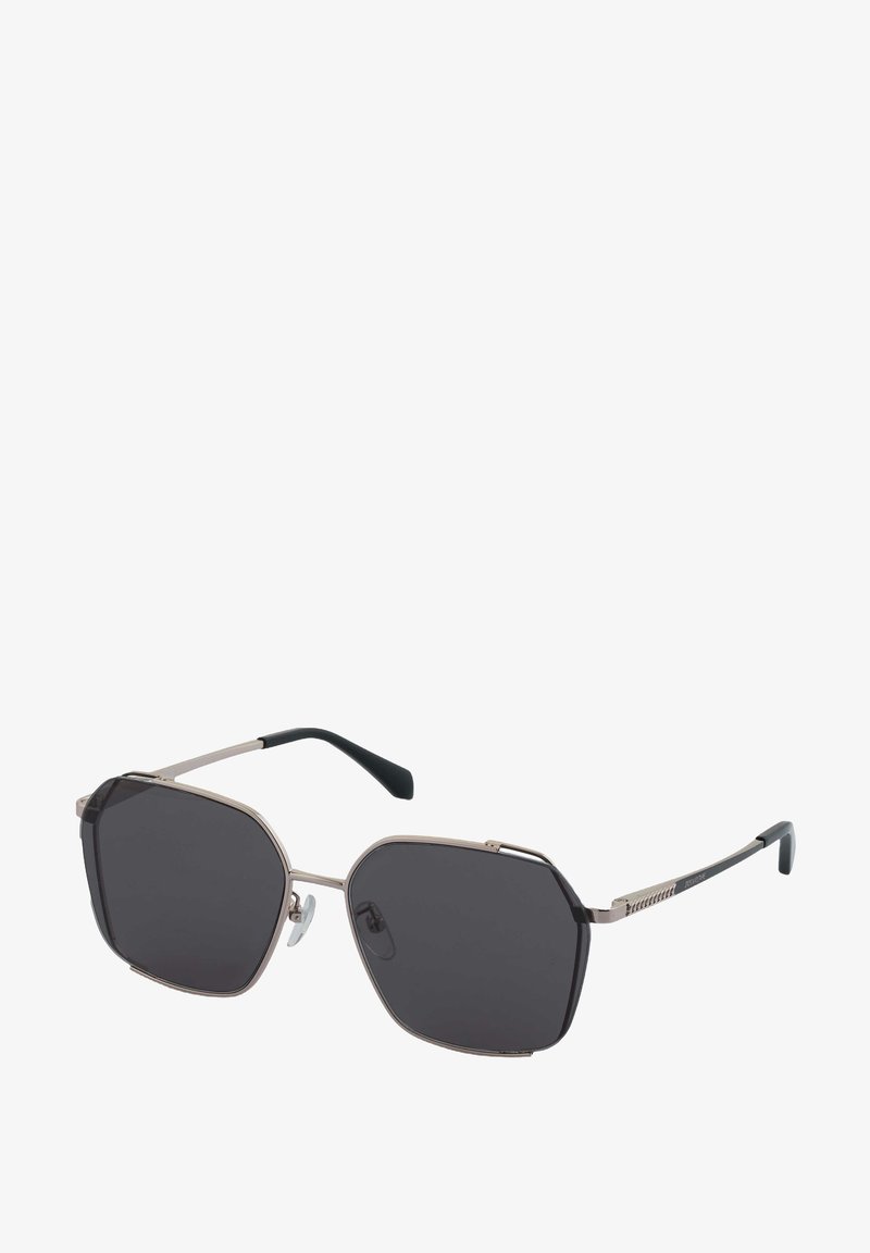 Sonnenbrille mit achtkantigen dunklen Gläsern, dünnem metallischem Rahmen in Silber und schwarz gummierten Bügelspitzen. Verfügt über verstellbare Nasenpads.