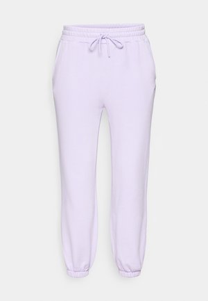 Lavendel joggebukser med elastisk linning og snøring, sidelommer og smalnede bufser ved anklerne. Mykt, glatt stoff.