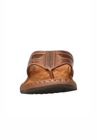 Brown leather sandal with a textured footbed, wide straps, and a stitched rubber sole. Features cutouts along the straps for breathability.