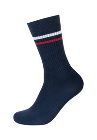 Calzino in cotone blu navy con texture a coste e strisce bianche e rosse sul polsino. Design alla caviglia con tallone rinforzato.