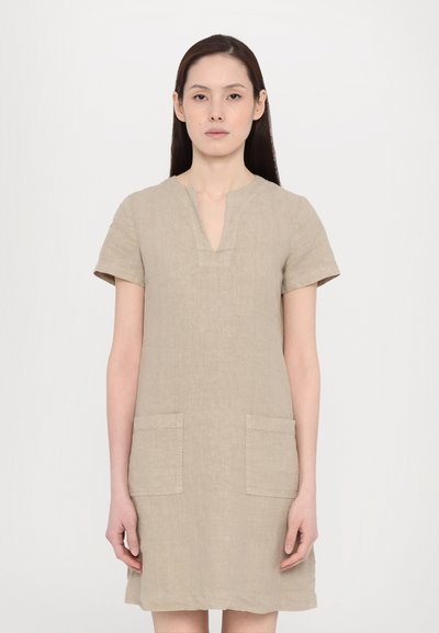 Beige linen dress with short sleeves, V-neckline, and two front pockets. Simple design with a relaxed fit and soft texture.