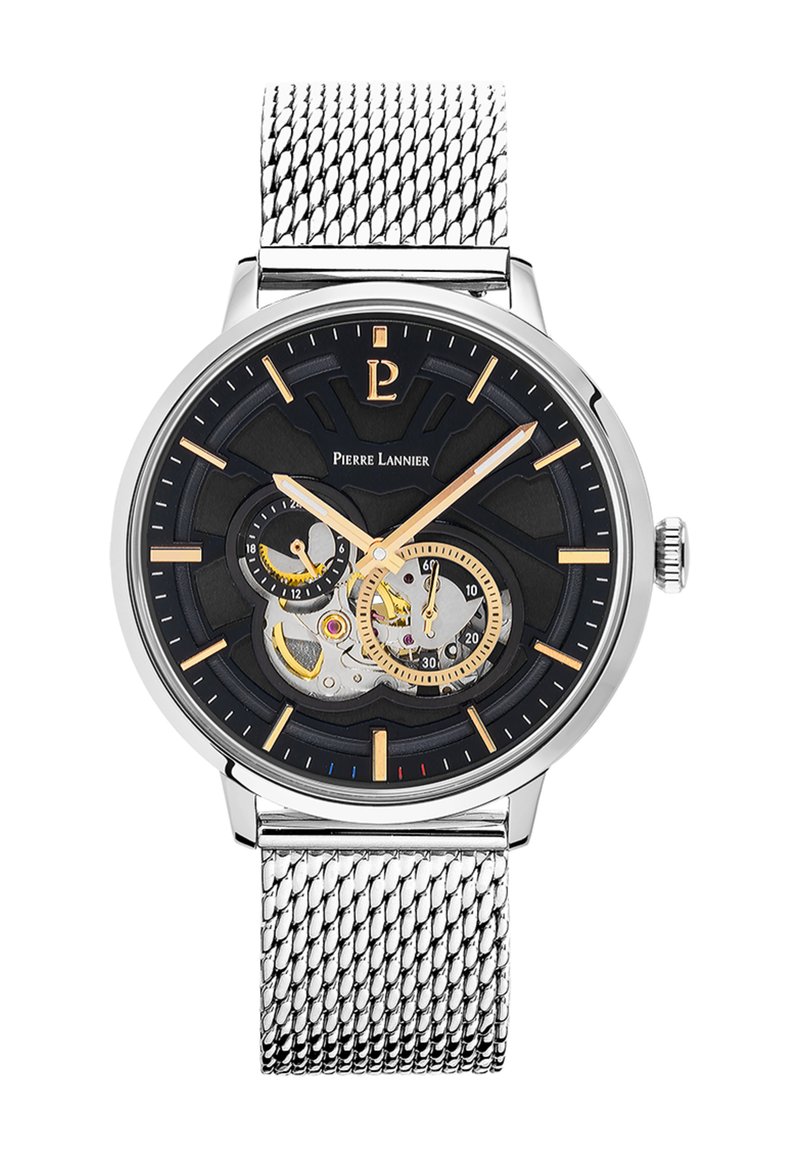 Montre automatique avec un cadran noir, accents en squelette argentés, index heures dorés et un bracelet en maille argentée. Présente un design mécanique complexe.