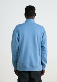 New Balance ATHLETICS 1/2 ZIP - Športni pulover - heron blue