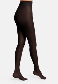 Collant neri opachi con vita alta, texture liscia e design senza cuciture che si estende fino ai piedi. Adatti a diversi outfit.