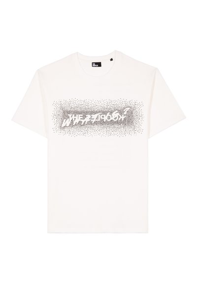 T-shirt de algodão branco com uma impressão gráfica em pontos pretos que diz "A ZEBRA" em destaque no peito, numa fonte moderna e ousada.