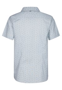 Camicia a maniche corte di un leggero azzurro con un piccolo motivo a pois blu navy, dotata di colletto e orlo dritto, realizzata in un tessuto testurizzato.
