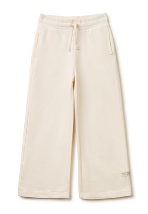 Kremowe spodnie dresowe o szerokich nogawkach z elastycznym pasem, sznurkiem do regulacji, bocznymi kieszeniami oraz małą naszywką z logo przy krawędzi na jednolitym tle.